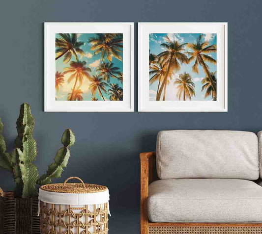 WanderNest Shop's vibrant tropical scene featuring tall palm trees silhouetted against a bright blue sky, dotted with soft white clouds. Golden sunlight filters through, casting a warm, dreamy glow that evokes a sense of relaxation and escape. The tranquil skyward view summons memories of dozing in a hammock, gently swaying to the soothing sound of ocean waves lapping the nearby shore. Create your personal oasis with this beautiful artwork as a focal point.