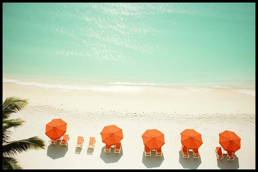 WanderNest's high-resolution digital wall art photography featuring a tranquil aerial view of a tropical beach with soft white sand, gentle ocean waves, and crystal-clear turquoise water. Five vibrant orange beach umbrellas with matching lounge chairs are neatly arranged along the shore, creating a minimalist and modern coastal scene. Perfect for summer decor, beach-themed interiors, or vacation home wall art. Printable digital download ideal for instant decor refresh.